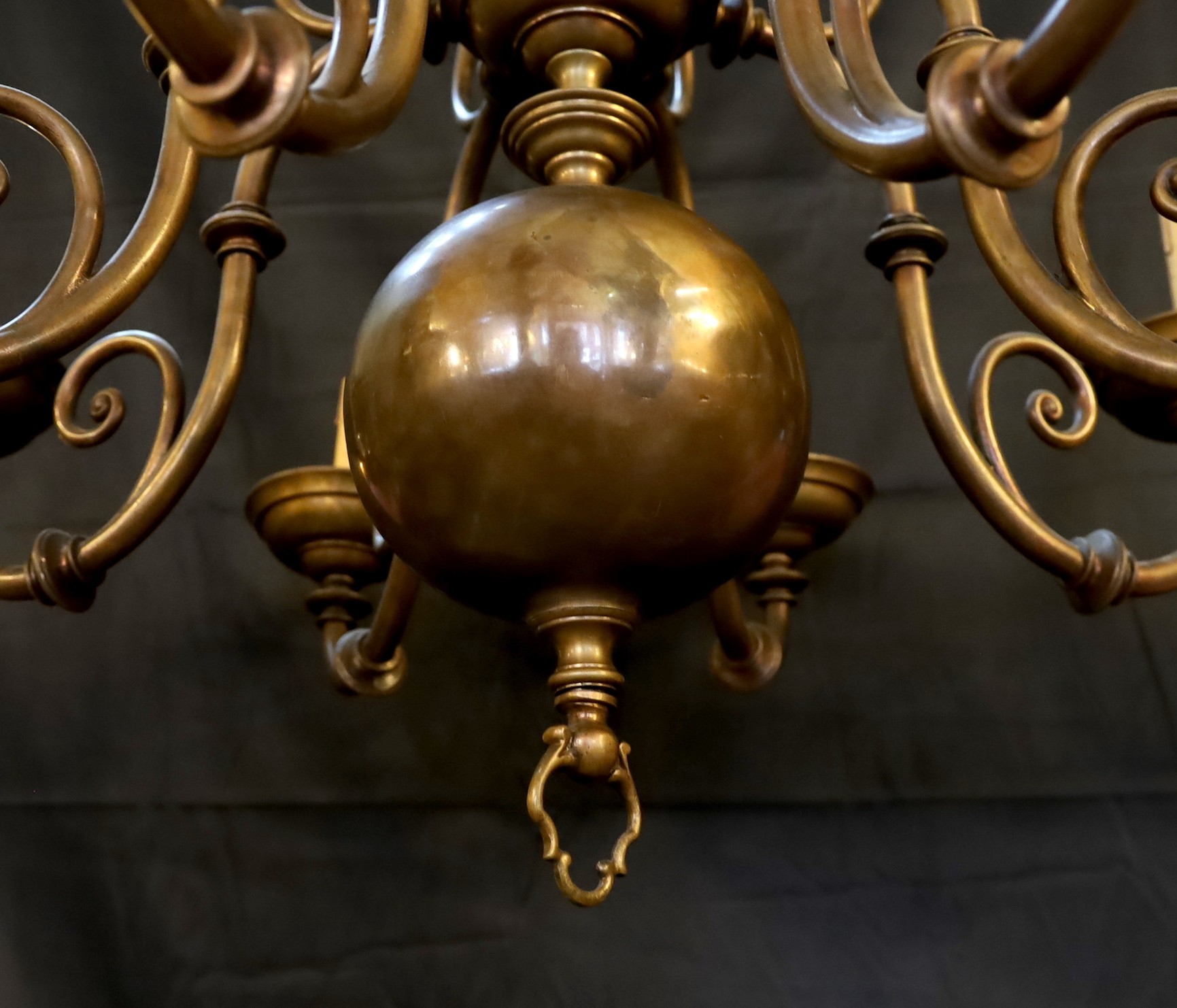 An early 20th century 17th century Dutch style brass eight light chandelier, height 82cm width 82cm